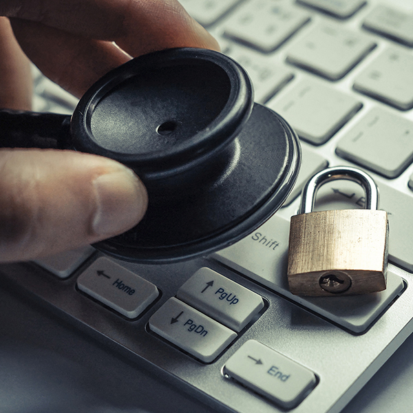 stethoscope and lock on keyboard